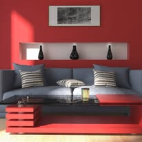 A contemporary living room featuring vibrant red walls and a stylish couch, creating a bold and inviting atmosphere.
